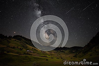 Milky way and Perseid meteor shower in the Transylvania mountains , Romania Stock Photo
