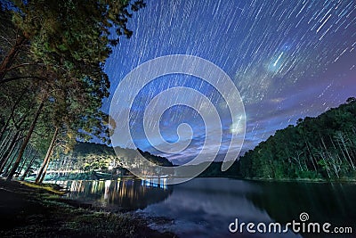 The Milky Way rises above the reservoir Stock Photo