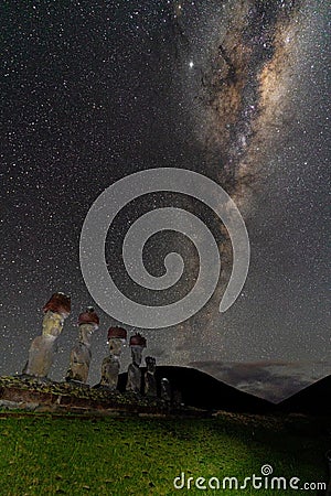 Milky Way Shows Above Moai On Easter Island, Chile Stock Photo