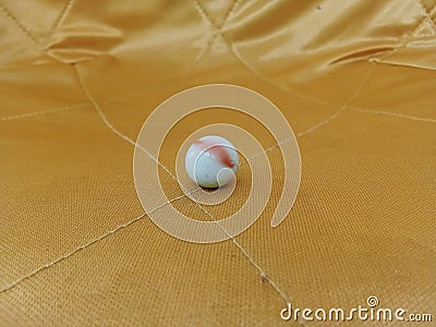 Milky white marbles are placed in the background Stock Photo