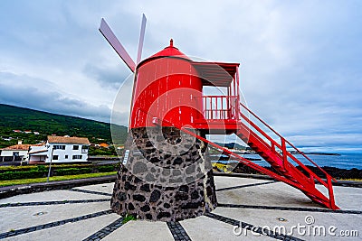 mill on Avenida do Mar, red with strong colors in the parish of SÃ£o Roque, Pico Island, Azores archipelago. Stock Photo