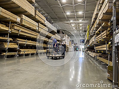 Mill Creek, WA USA - circa June 2022: View of a couple shopping for lumber inside a Lowe`s home improvement store Editorial Stock Photo