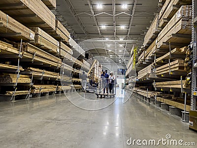 Mill Creek, WA USA - circa June 2022: View of a couple shopping for lumber inside a Lowe`s home improvement store Editorial Stock Photo