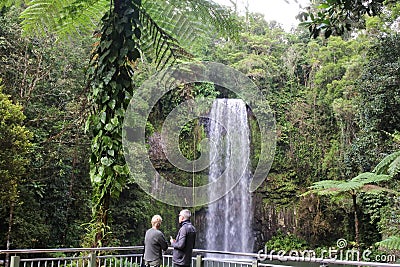 Active senior couple visit at Millaa Millaa Falls Queensland Australia Editorial Stock Photo