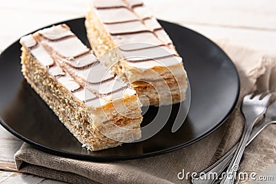 Millefoglie or French mille-feuille on white wood Stock Photo