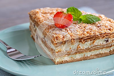 Millefoglie or mille-feuille pastry on a plate with decoration Stock Photo