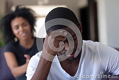 Millennial african couple are quarrelling at home Stock Photo