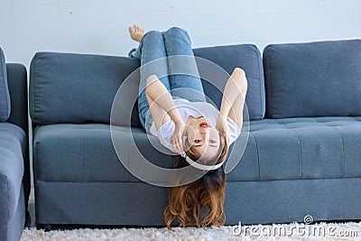 Asian young happy female wearing stereo wireless headset Stock Photo