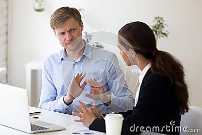 Millennial businessman rejecting giving interview to journalist Stock Photo