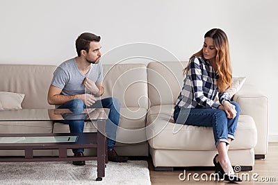 Angry husband proving point of view during fight with wife Stock Photo