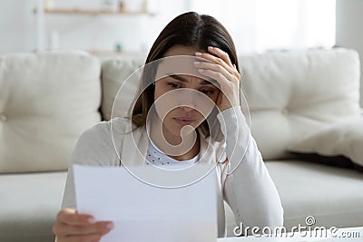 Woman holding letter read unpleasant news from friend or relative Stock Photo