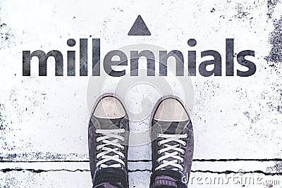 Millennials concept with pair of sneakers on the pavement Stock Photo