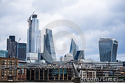 The Millennium Bridge, officially known as the London Millennium Footbridge, is a steel suspension bridge for pedestrians crossing Editorial Stock Photo