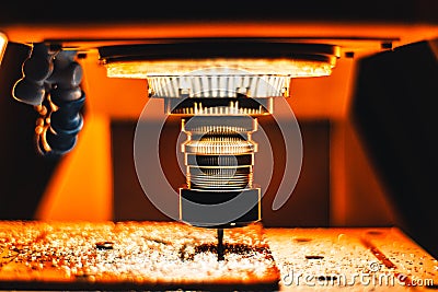 Milling CNC maching in strong orange light Stock Photo