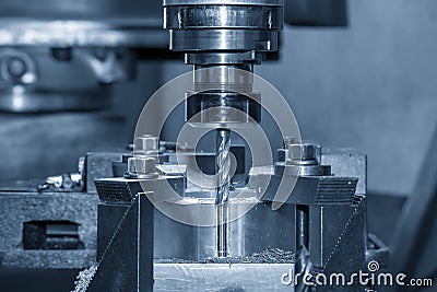 The milling machine make the hole on the work pieces by drill tools. Stock Photo