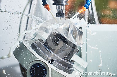 Milling metalworking process. Industrial CNC metal machining by vertical mill Stock Photo