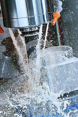 Milling metalworking process. Industrial CNC metal machining by vertical mill Stock Photo