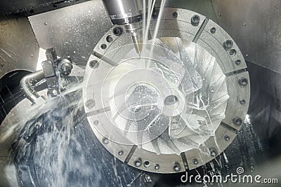 Milling metalworking process. Industrial CNC metal machining by vertical mill Stock Photo