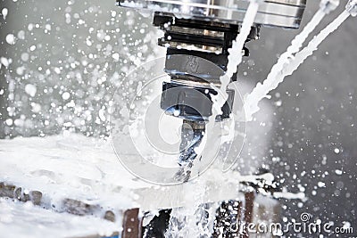 Milling metalworking process. Industrial CNC metal machining by vertical mill Stock Photo