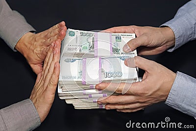 A million rubles in men's hands. Bribery in Russian rubles in a dark room. The concept of corruption and bribery. rejection of Stock Photo