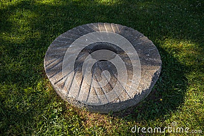 Millstones for grinding wheat or other grains. grinding stones. Stock Photo