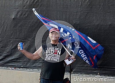 Protesting Trump Supporter with Flag Editorial Stock Photo