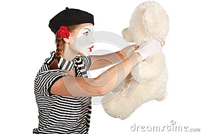 Mime comedian talking with teddy bear Stock Photo