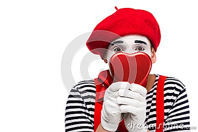 mime covering face with heart shaped gift box Stock Photo