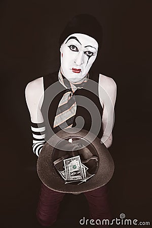 Mime with hat in hand begging Stock Photo