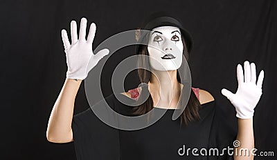 Female Clown Mime Looks Up in White Face Stock Photo