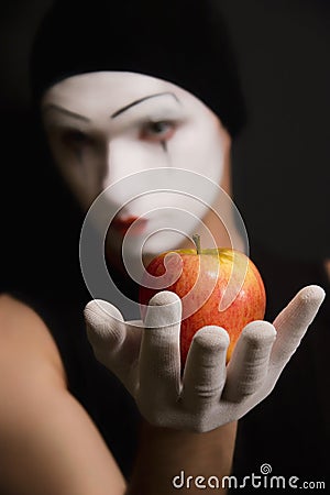 Mime with red apple Stock Photo