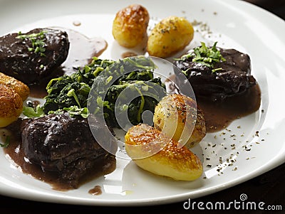 The `Mimos de Porco Preto` is a typical plate from Mediterranean Food made with Black Pig Meat. Stock Photo