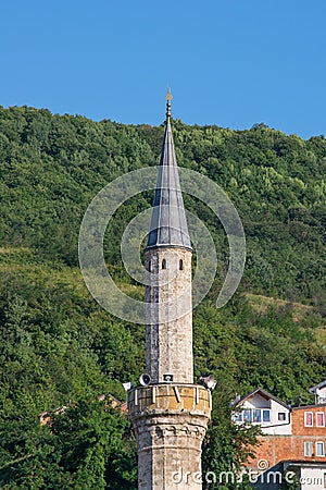 The minaret tower of a Muslim mosque in the city of Prizren, Kosovo, former Yugoslavia. Editorial Stock Photo