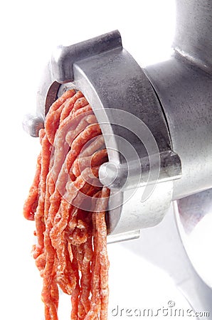 Minced meat comes fresh from a mincer Stock Photo