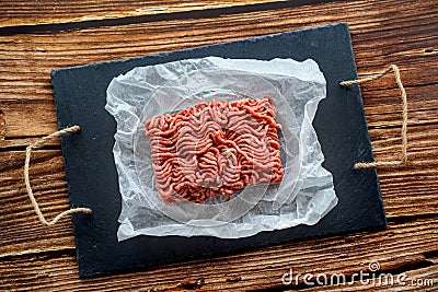 Minced meat on cooking paper and stone tray Stock Photo