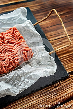 Minced meat on cooking paper and stone tray Stock Photo