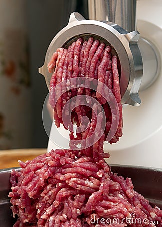 Minced meat in grinder Stock Photo