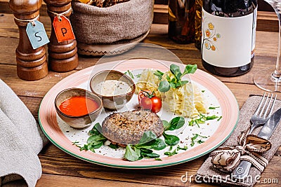 Minced mutton chop with boiled potatoes and sauce Stock Photo