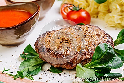 Minced mutton chop with boiled potatoes and sauce Stock Photo