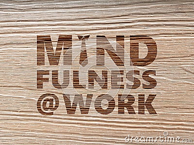 Mindfulness At Work concept using wood grain background Stock Photo