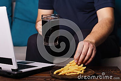 Mindless snacking, overeating, laziness, homebody Stock Photo