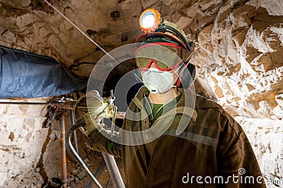 Miner inside a gold mine. Editorial Stock Photo