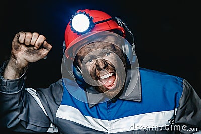 Miner man hands protest fist up revolution coal mine. Concept workers strike Stock Photo