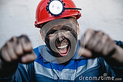 Miner man hands protest fist up revolution coal mine. Concept workers strike Stock Photo