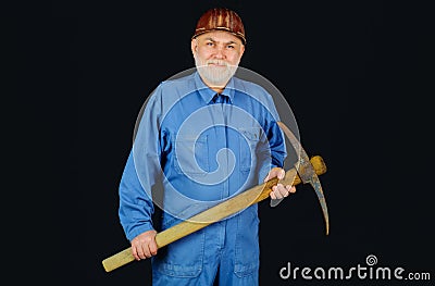 Miner man with pickaxe. Construction worker with pickaxe. Male laborer with building tools. Bearded man builder in Stock Photo