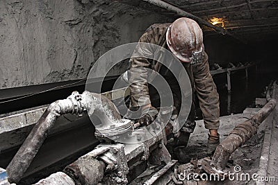 Miner in a mine Stock Photo