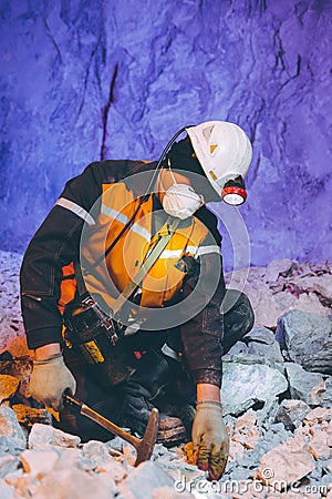 Miner underground mining gold Stock Photo