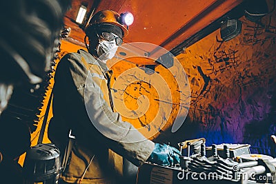 Miner underground mining gold Stock Photo