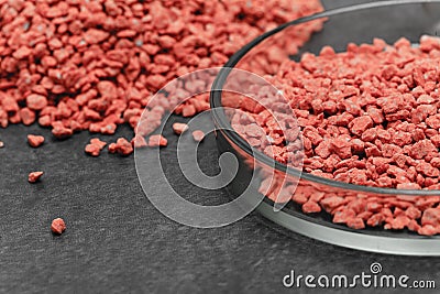 Mineral fertilizer with phosphorus in red with chemical glass Stock Photo