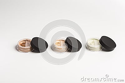 Mineral makeup powder twist seal sifter isolated on white background. Many beige foundation powder. Skin tone face Stock Photo